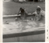 Marshall and Ralph in backyard pool, 1955